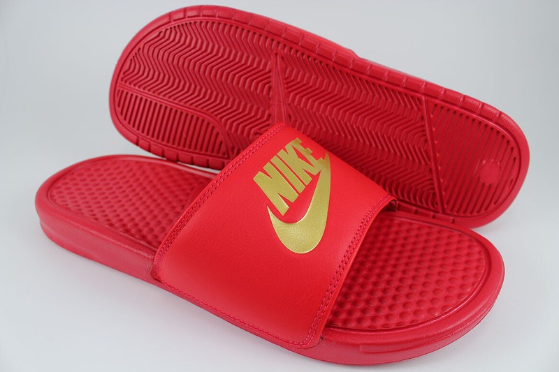 gold and red nike slides